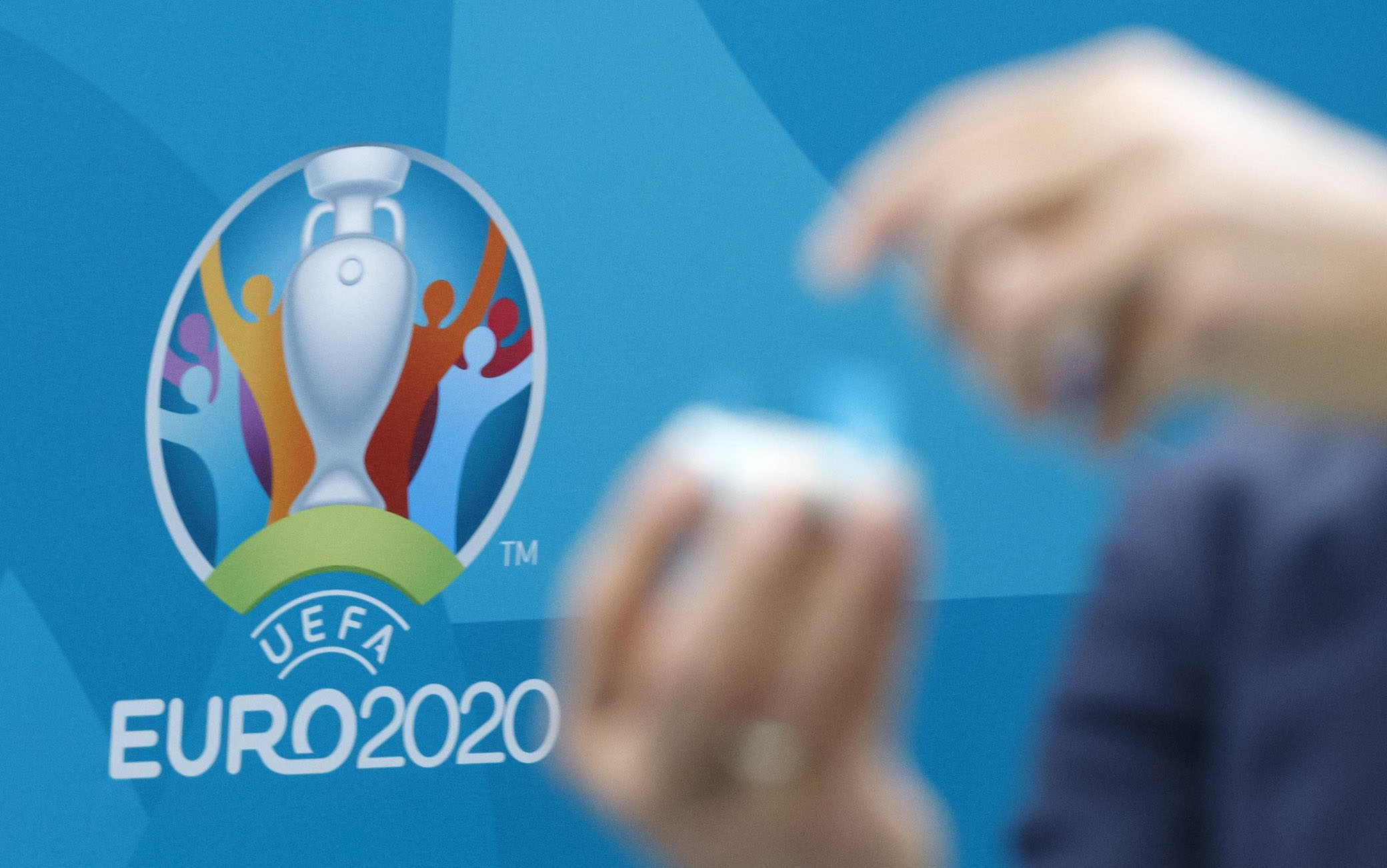 epa08016923 Former Greek soccer player Angelos Charisteas opens a ball containing the name of a national soccer team during  the drawing of the UEFA EURO 2020 Play-off matches, at the UEFA headquarters in Nyon, Switzerland, 22 November 2019.  EPA/SALVATORE DI NOLFI